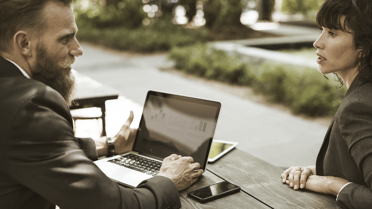 Man and woman discussing business